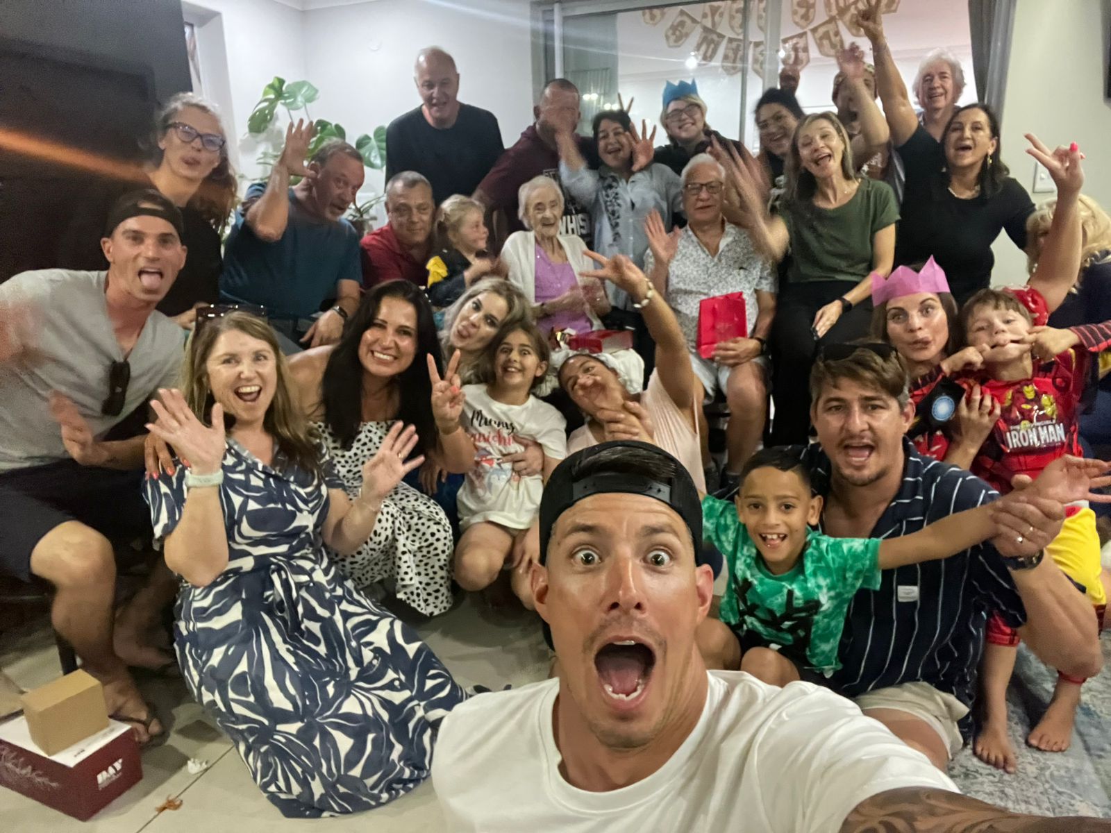 Large family group celebrating together indoors
